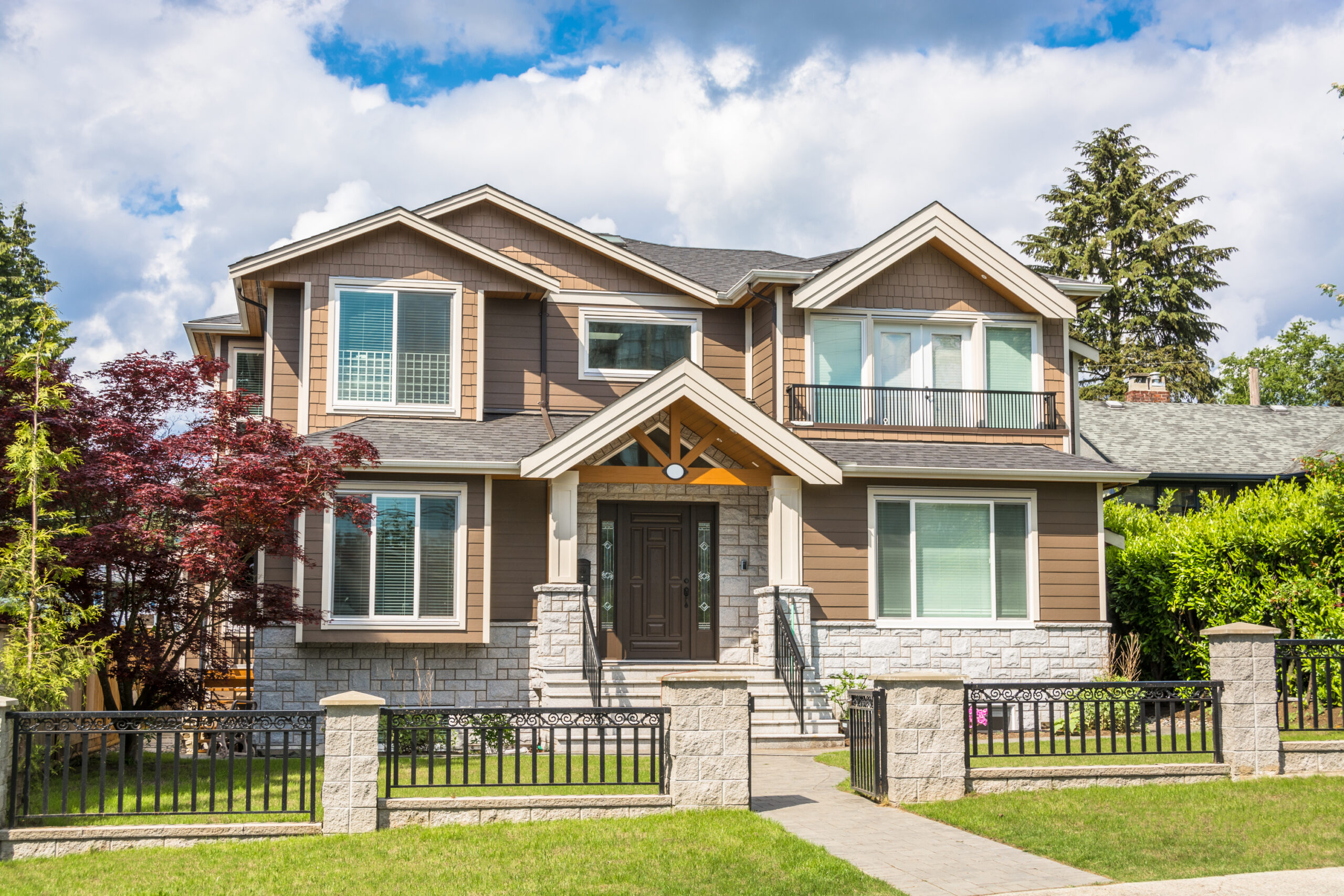 modern luxury residential house with tile paved pathway cloudy sky background scaled
